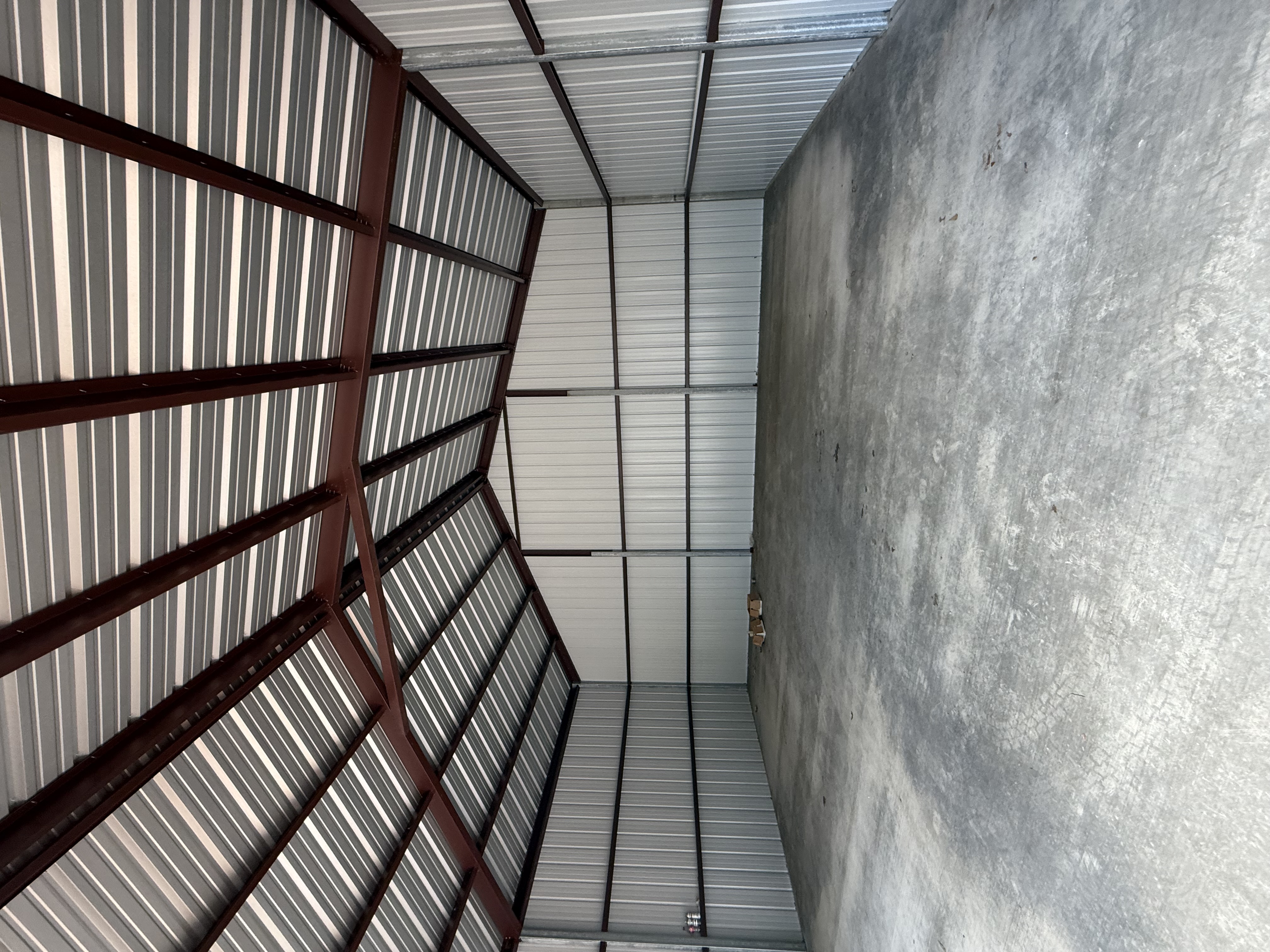 Framed metal building structure under construction